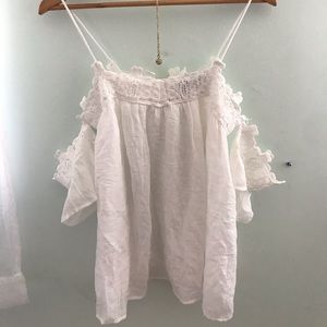 A white top with some lace designs